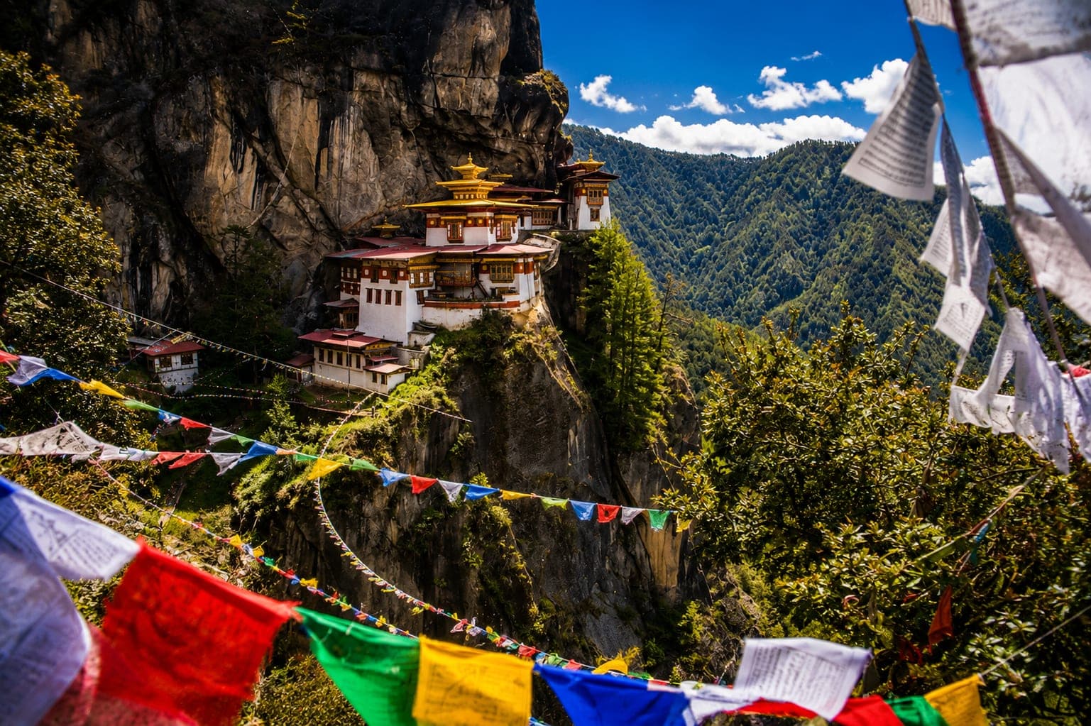 Prayer flags leading to the Tiger's Nest Monastery in Paro, Bhutan