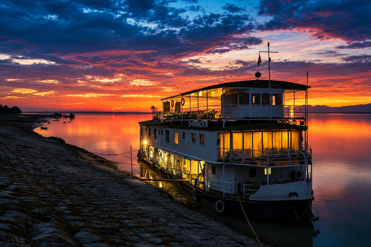 A river cruise boat on the Brahmaputra at sunset