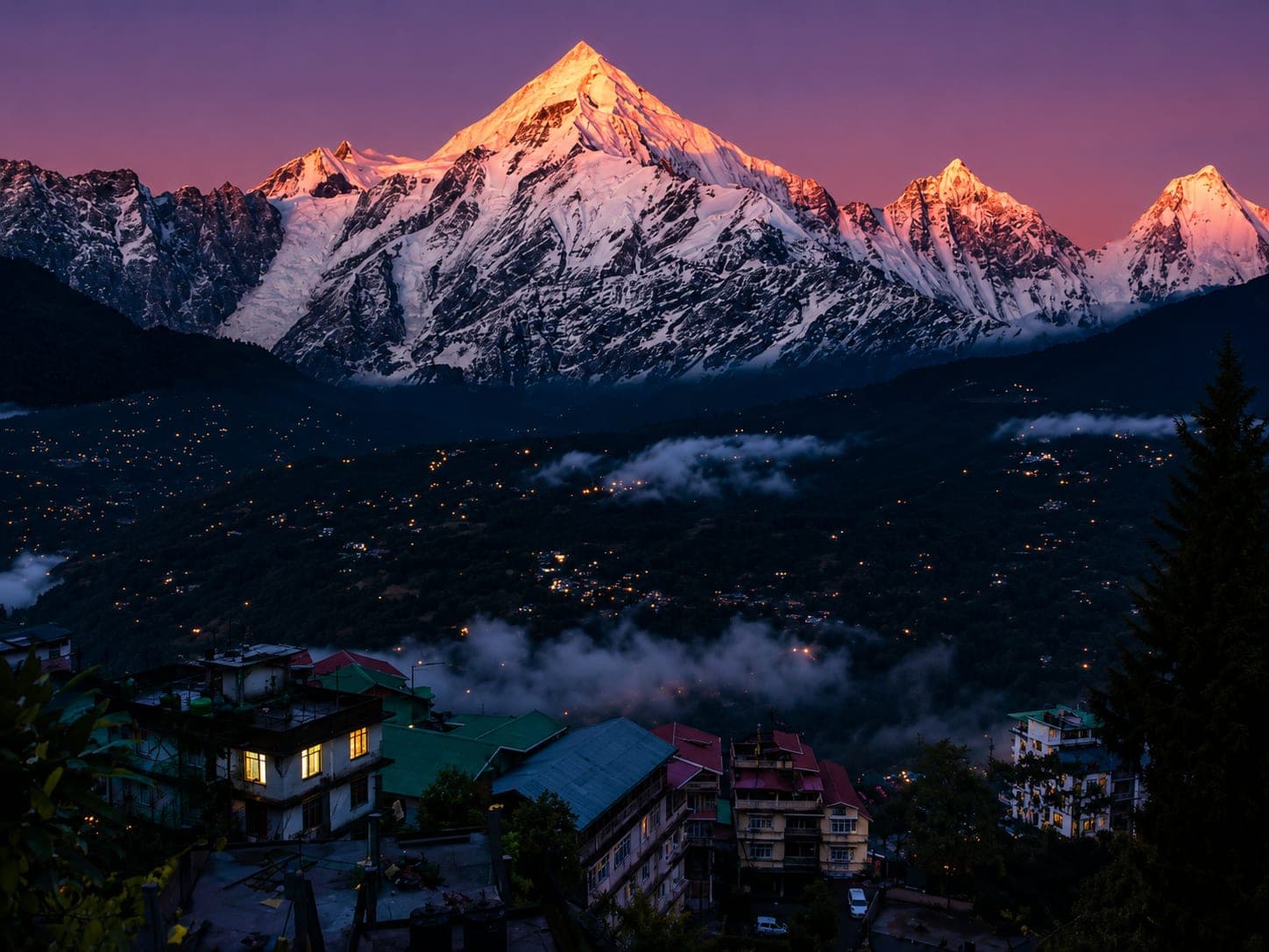 Snow peaks glowing at twilight above Kausani town