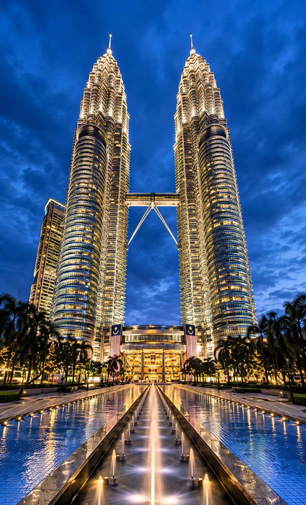 The Petronas Twin Towers lit up at night in Kuala Lumpur, Malaysia
